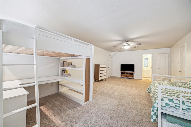 unfurnished bedroom featuring a ceiling fan and carpet flooring