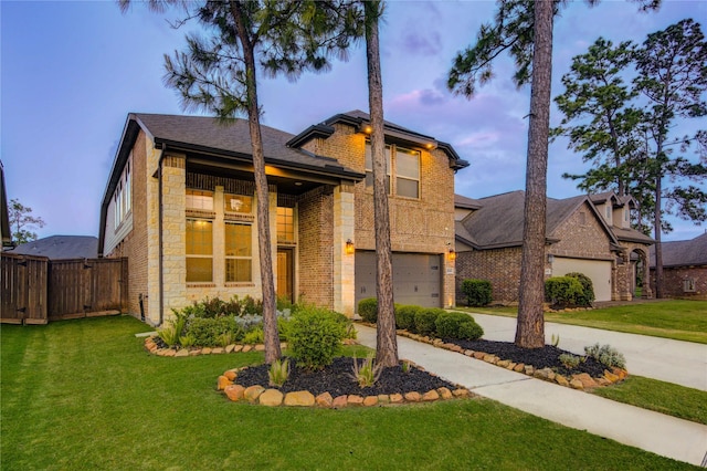 view of front facade featuring stone siding, a garage, fence, a front lawn, and driveway