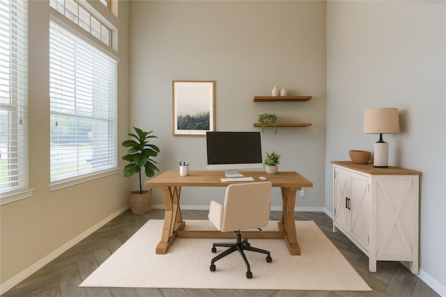 office space with baseboards