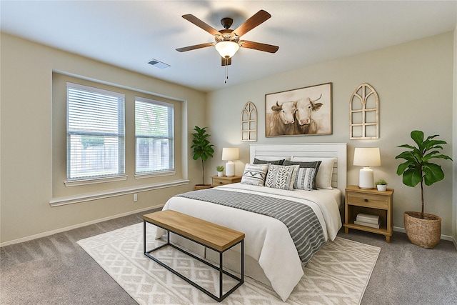 bedroom with ceiling fan, carpet flooring, baseboards, and visible vents