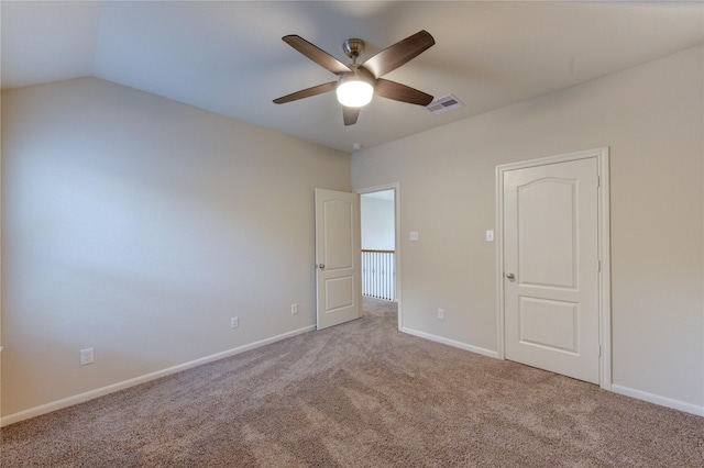 unfurnished bedroom with carpet floors, baseboards, and visible vents