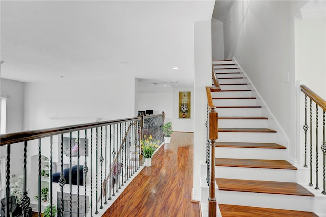 10007 Autumn Lake Trl, Pearland, TX 77584 - stairs featuring wood finished floors and recessed lighting