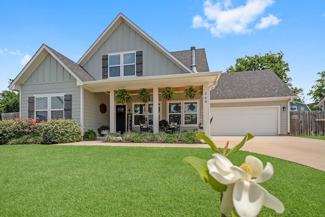 craftsman-style home featuring board and batten siding and a front yard