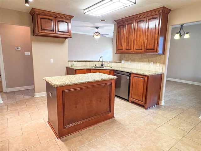 110 Hummingbird Ct, Richwood, TX 77566 - kitchen with a ceiling fan, a center island, stainless steel dishwasher, a sink, and light stone counters