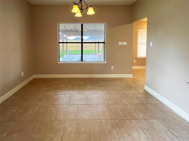110 Hummingbird Ct, Richwood, TX 77566 - unfurnished dining area with an inviting chandelier, baseboards, and light tile patterned floors