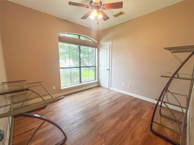 110 Hummingbird Ct, Richwood, TX 77566 - empty room with baseboards, a ceiling fan, hardwood / wood-style flooring, and visible vents