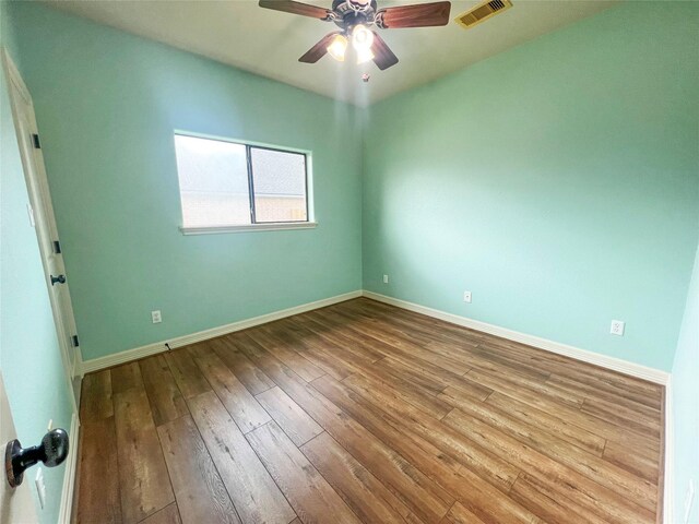 110 Hummingbird Ct, Richwood, TX 77566 - empty room with baseboards, ceiling fan, hardwood / wood-style floors, and visible vents