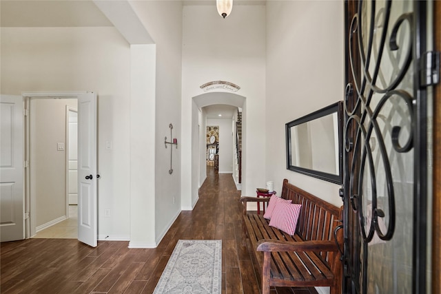 21023 Barrett Woods Dr, Richmond, TX 77407 - foyer entrance with arched walkways, baseboards, and wood finished floors