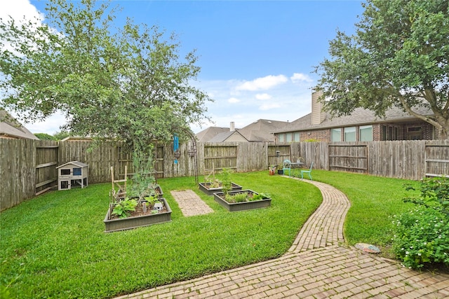 21023 Barrett Woods Dr, Richmond, TX 77407 - view of yard with a fenced backyard and a vegetable garden