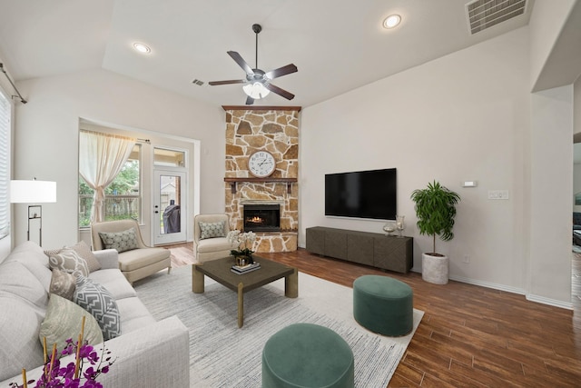 21023 Barrett Woods Dr, Richmond, TX 77407 - living area with a fireplace, a ceiling fan, wood finished floors, lofted ceiling, and visible vents