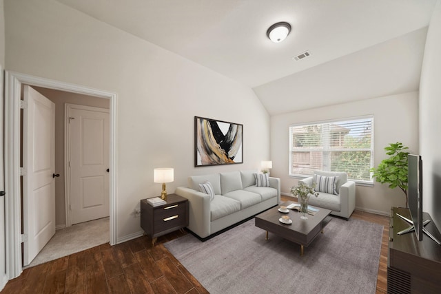 21023 Barrett Woods Dr, Richmond, TX 77407 - living room featuring visible vents, baseboards, dark wood finished floors, and vaulted ceiling