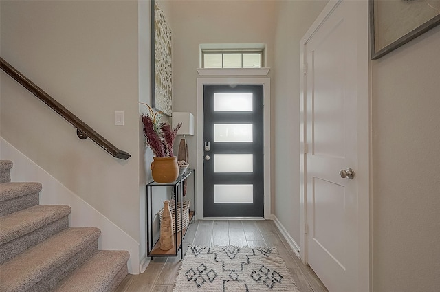 23611 Blackhaw Blossom Ln, Katy, TX 77493 - entrance foyer featuring baseboards, light wood-type flooring, and stairs