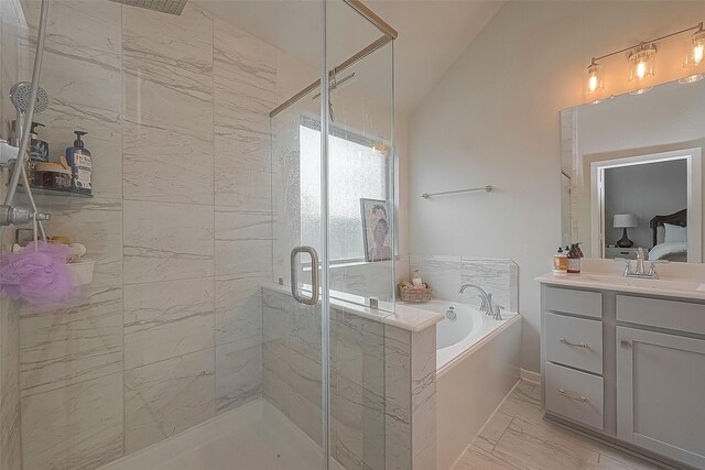 23611 Blackhaw Blossom Ln, Katy, TX 77493 - full bath featuring marble finish floors, a garden tub, a stall shower, vanity, and lofted ceiling