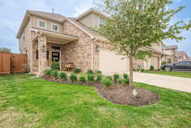 23611 Blackhaw Blossom Ln, Katy, TX 77493 - view of front facade with brick siding, fence, a front yard, and concrete driveway