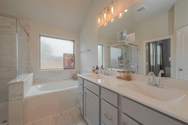 23611 Blackhaw Blossom Ln, Katy, TX 77493 - bathroom featuring visible vents, a sink, marble finish floor, and a stall shower
