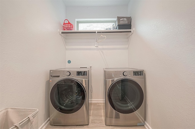 23611 Blackhaw Blossom Ln, Katy, TX 77493 - washroom with washing machine and dryer and light wood-style floors
