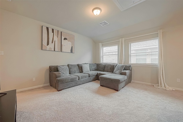 23611 Blackhaw Blossom Ln, Katy, TX 77493 - living room featuring light colored carpet, lofted ceiling, and attic access