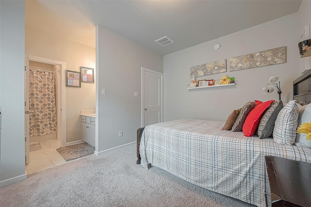 23611 Blackhaw Blossom Ln, Katy, TX 77493 - bedroom featuring visible vents, connected bathroom, baseboards, and light carpet