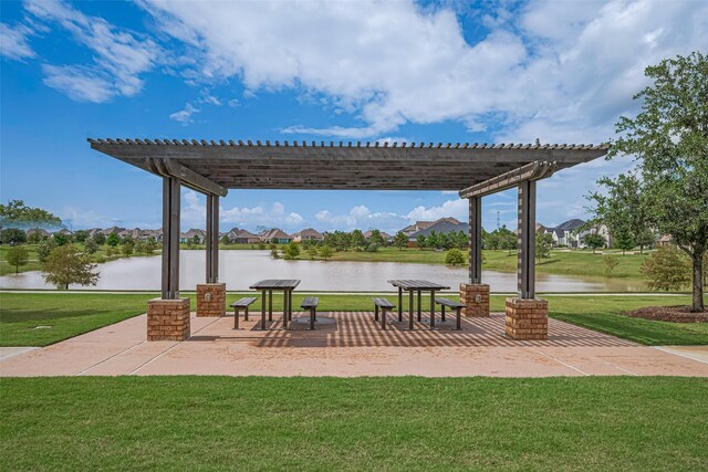 23611 Blackhaw Blossom Ln, Katy, TX 77493 - view of home's community with a pergola, a lawn, and a water view