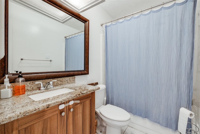 bathroom featuring vanity, shower / tub combo with curtain, and toilet
