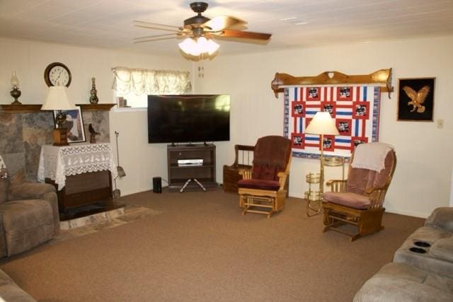 carpeted living room with a ceiling fan