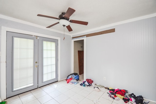 spare room with light tile patterned floors, ceiling fan, and french doors