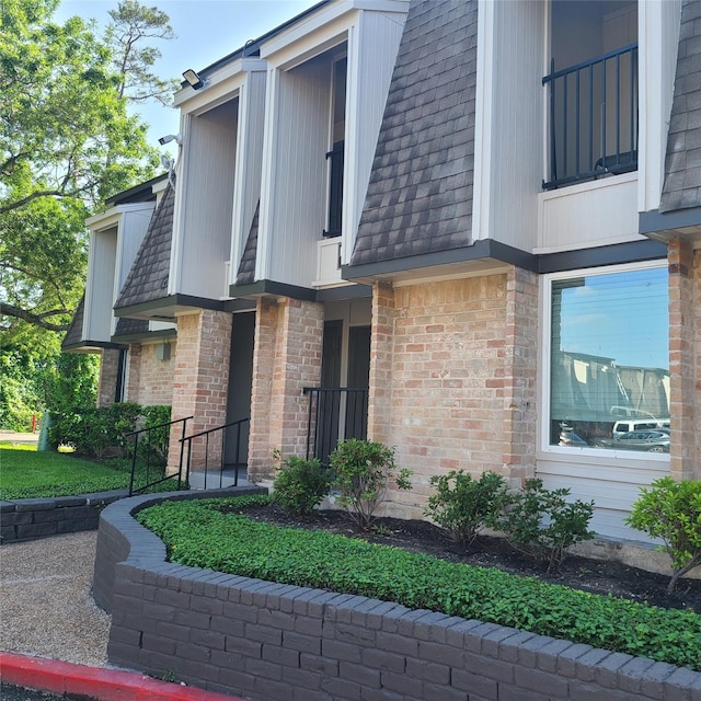 12633 Memorial Dr Unit 122, Houston, TX 77024 - view of side of property featuring brick siding
