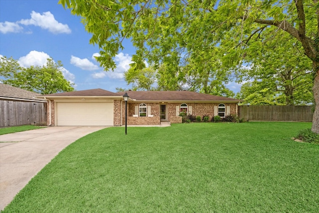 ranch-style home featuring brick siding, a garage, a front lawn, and concrete driveway