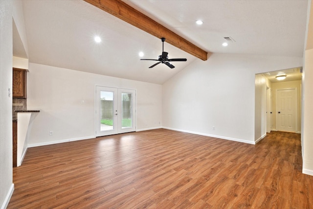unfurnished living room with ceiling fan, recessed lighting, baseboards, vaulted ceiling with beams, and wood finished floors