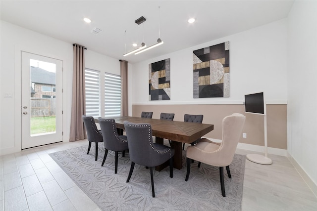 dining room featuring recessed lighting, wood finished floors, and visible vents