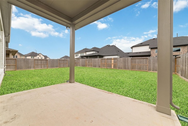 view of patio with a residential view and a fenced backyard