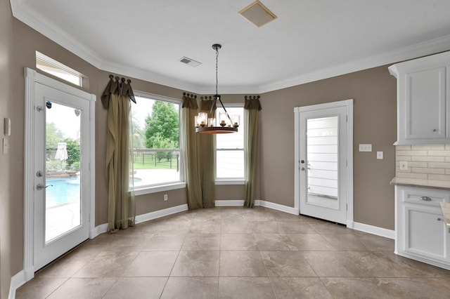 19731 Stone Lake Dr, Tomball, TX 77377 - unfurnished dining area featuring a chandelier, ornamental molding, and baseboards