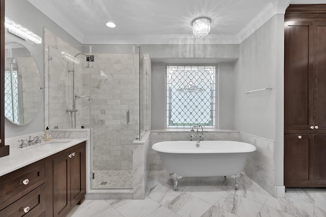 19731 Stone Lake Dr, Tomball, TX 77377 - full bathroom with a shower stall, a soaking tub, vanity, ornamental molding, and a wainscoted wall