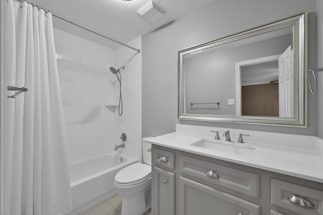 19731 Stone Lake Dr, Tomball, TX 77377 - full bath with a textured ceiling, vanity, toilet, shower / bath combination with curtain, and tile patterned flooring