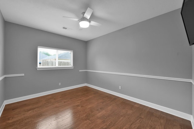 19731 Stone Lake Dr, Tomball, TX 77377 - empty room with ceiling fan, dark wood-style flooring, and baseboards
