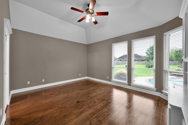 19731 Stone Lake Dr, Tomball, TX 77377 - unfurnished room with ceiling fan, dark wood finished floors, healthy amount of natural light, lofted ceiling, and baseboards