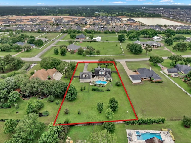 19731 Stone Lake Dr, Tomball, TX 77377 - aerial perspective of suburban area with a pool and property boundaries highlighted