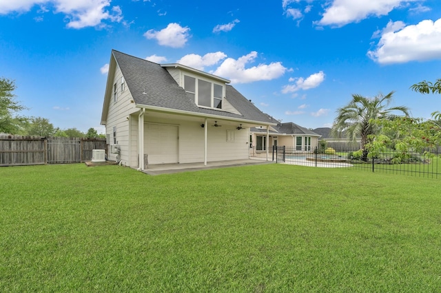19731 Stone Lake Dr, Tomball, TX 77377 - back of house with a patio area, a ceiling fan, and a shingled roof