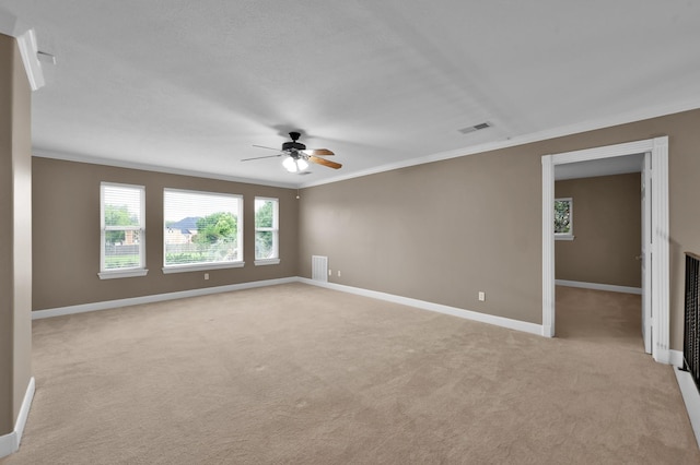 19731 Stone Lake Dr, Tomball, TX 77377 - empty room featuring ornamental molding, light carpet, ceiling fan, and baseboards