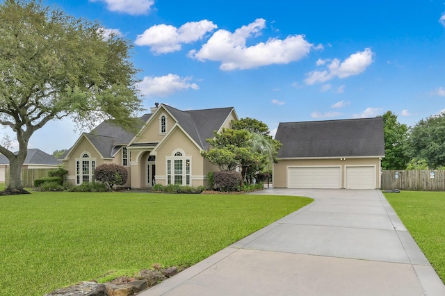 19731 Stone Lake Dr, Tomball, TX 77377 - traditional-style home featuring stucco siding, driveway, and a garage