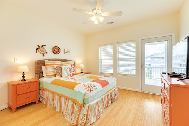 bedroom with access to exterior, a ceiling fan, baseboards, light wood-type flooring, and visible vents