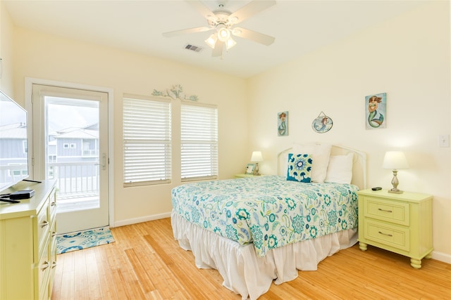 bedroom with access to outside, ceiling fan, light wood-style floors, baseboards, and visible vents