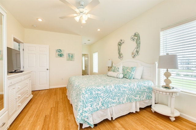 bedroom with baseboards, a ceiling fan, light wood-style flooring, and recessed lighting