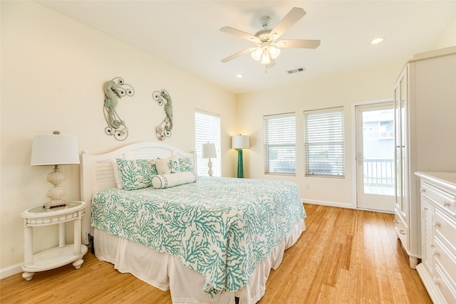 bedroom with baseboards, access to outside, light wood-style flooring, and visible vents