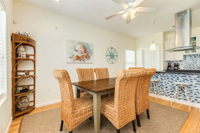 dining area with baseboards, recessed lighting, light wood finished floors, and ceiling fan