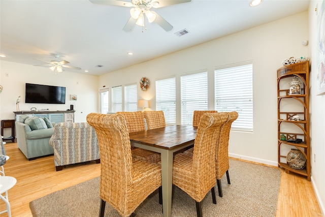 dining space featuring ceiling fan, visible vents, a healthy amount of sunlight, and light wood finished floors