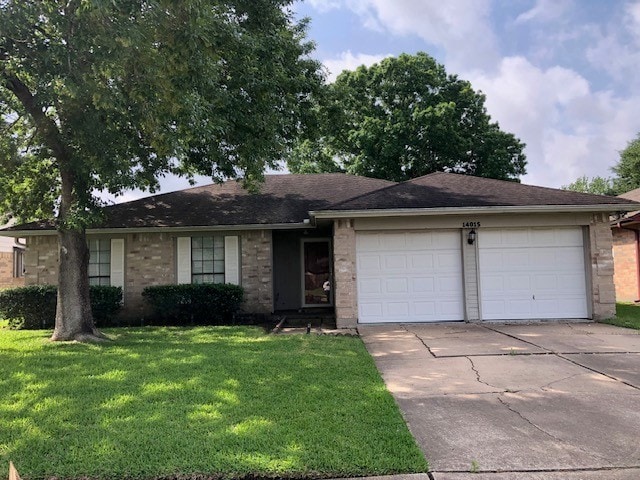 ranch-style house with an attached garage, brick siding, driveway, and a front yard
