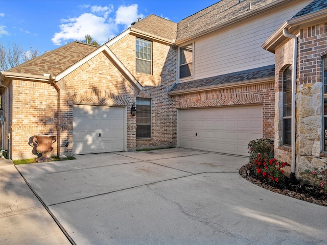 17306 Lake Chelan Ln, Humble, TX 77346 - view of side of home featuring roof with shingles, driveway, and brick siding