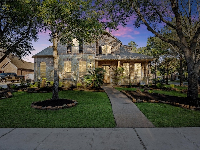 17306 Lake Chelan Ln, Humble, TX 77346 - view of front of home with stone siding, a front lawn, and brick siding
