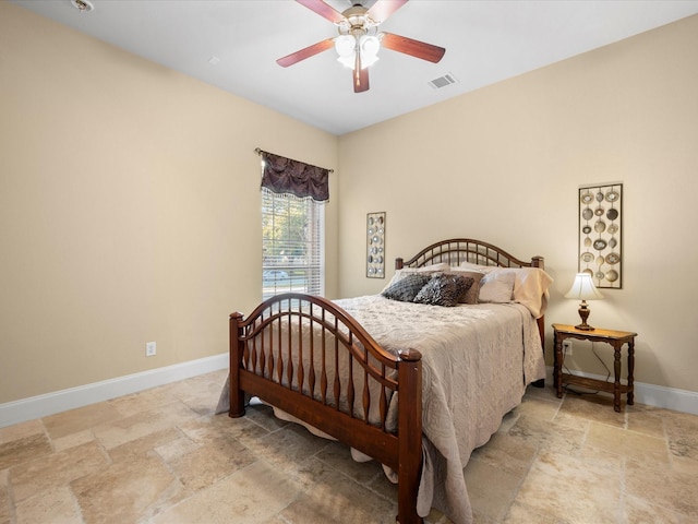 17306 Lake Chelan Ln, Humble, TX 77346 - bedroom with stone tile floors, a ceiling fan, baseboards, and visible vents